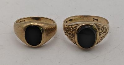 Two 9ct gold ladies signet rings set with black stones 6.05g total Location: If there is no