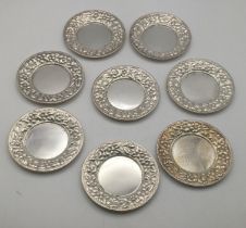 Eight Theordore B. Starr sterling silver pin dishes, with embossed boarders, total weight 230.5g