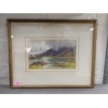 A watercolour depicting a Welsh mountain scene with rocks in the foreground, bearing signature '