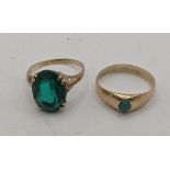Two gold ladies rings to include a 9ct gold ring fasted with a green coloured stone, along with a