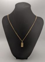 A 9ct gold necklace with a pendant 10.6g 9ct gold ingot pendant Location: If there is no condition