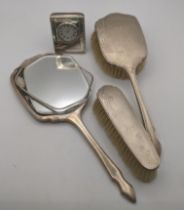 Mixed silver dressing table items to include a hand mirror A/F and two brushes along with a silver