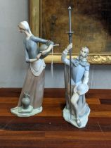 Two Lladro figures to include a woman with two water jugs, and a gentleman with a sword on one