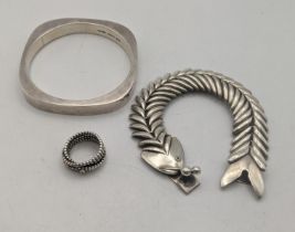 Silver jewellery to include a fish bracelet, a bangle and a ring total weight 104g Location: If