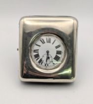 An early 20th century Goliath pocket watch with a silver fronted travel case, hallmarked