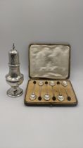 Silver to include a sugar coaster hallmarked London 1800, together with a set of six coffee spoons