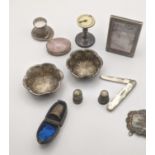 Mixed silver items to include a pair of embossed pin dishes, a silver picture frame, mother of pearl