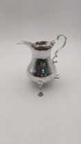 A George III silver cream jug, hallmarked London 1767, 80.6g, makers mark A.N.SA Location: If