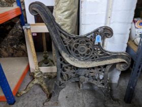 A pair of vintage painted cast iron bench ends, and a painted cast iron stand Location: If there