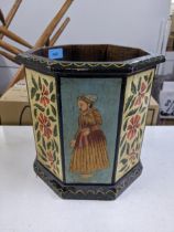 An early 20th century octagonal planter with decorated repeating panels of gentleman in Asian