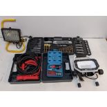 Two heavy duty security lights, a boxed set of jump leads, a screwdriver/drill set, and another