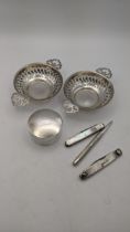 Mixed silver to include two pin dishes with pierced boarders and a trinket pot together with a