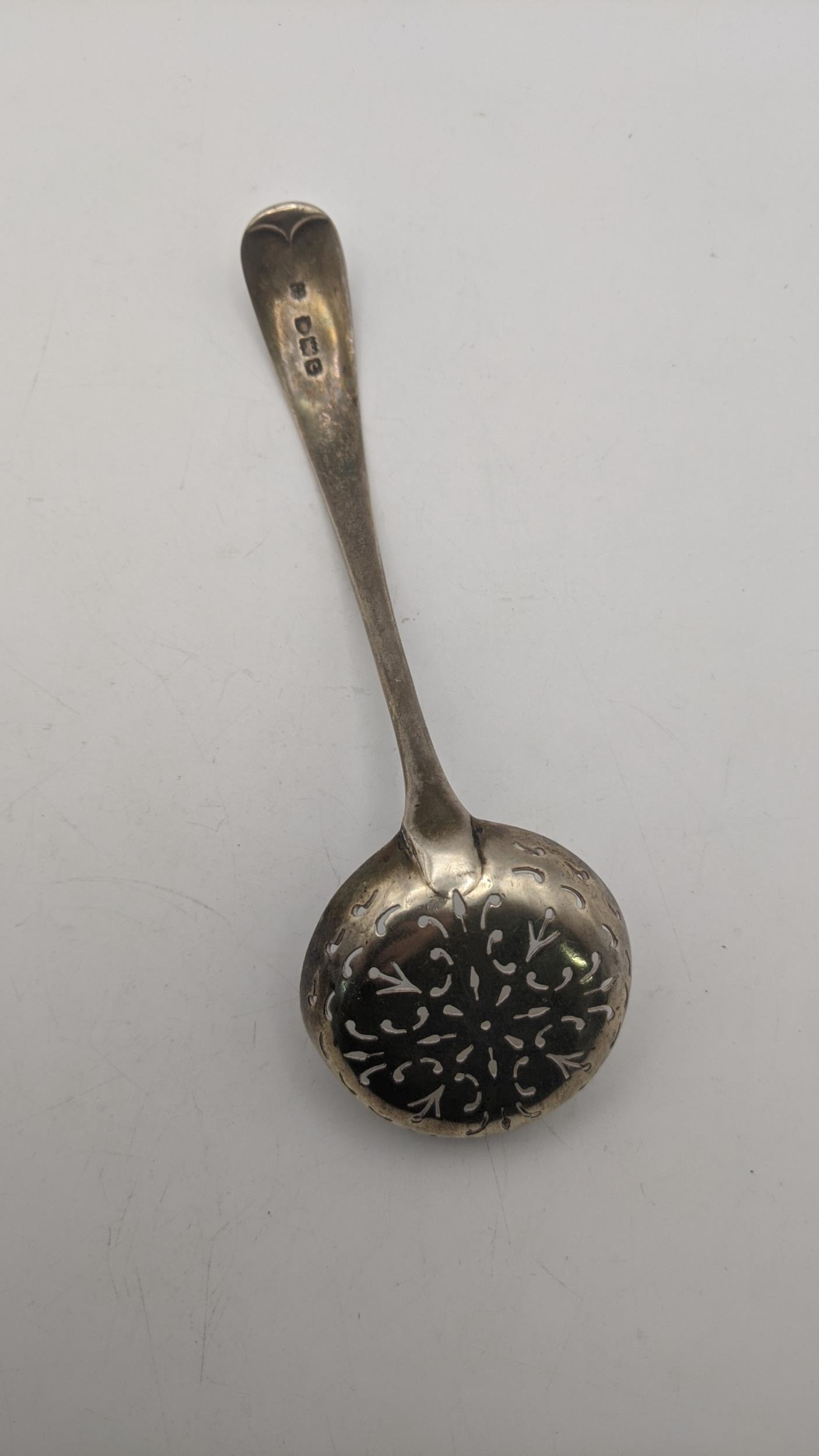 A silver sifter spoon with engraved and initiated ornament hallmarked London 1898, weight 50g - Image 2 of 3
