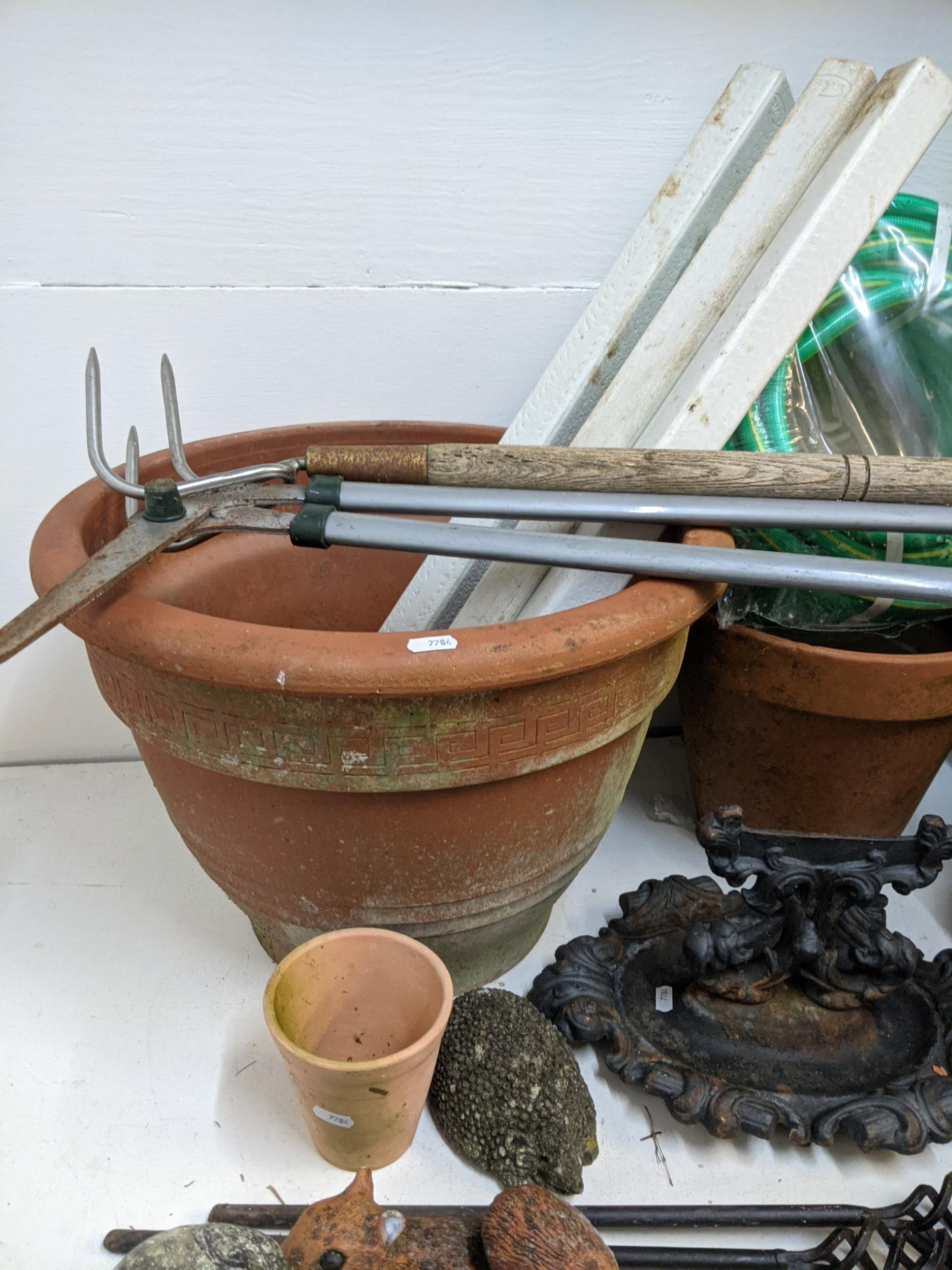 Garden related items to include pots, garden ornaments, a boot scraper, an unused hose, wooden - Image 2 of 9