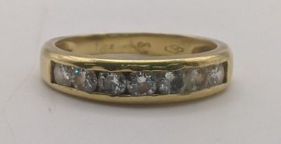 An 18ct gold half eternity ring set with five diamonds and two pace stones A/F 3.5g Location: If