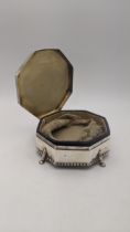 A silver dressing table ring box on four paw feet hallmarked Birmingham 1915 181.4g Location: If