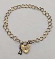 A 9ct gold curb link bracelet with a padlock clasp 5.9g Location: If there is no condition report