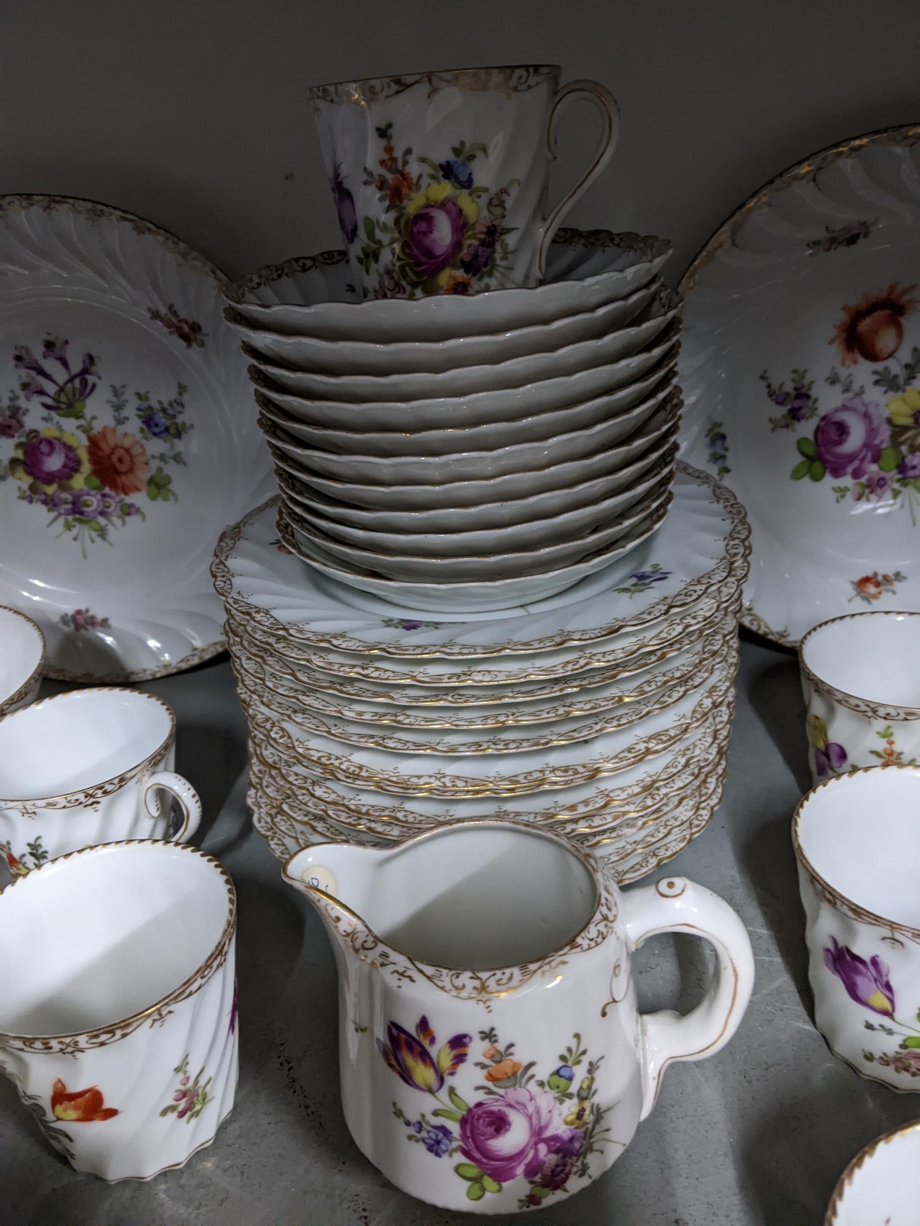 A late 19th Dresden porcelain tea set decorated with flower sprays and a gilt border, approx 41 - Image 2 of 4