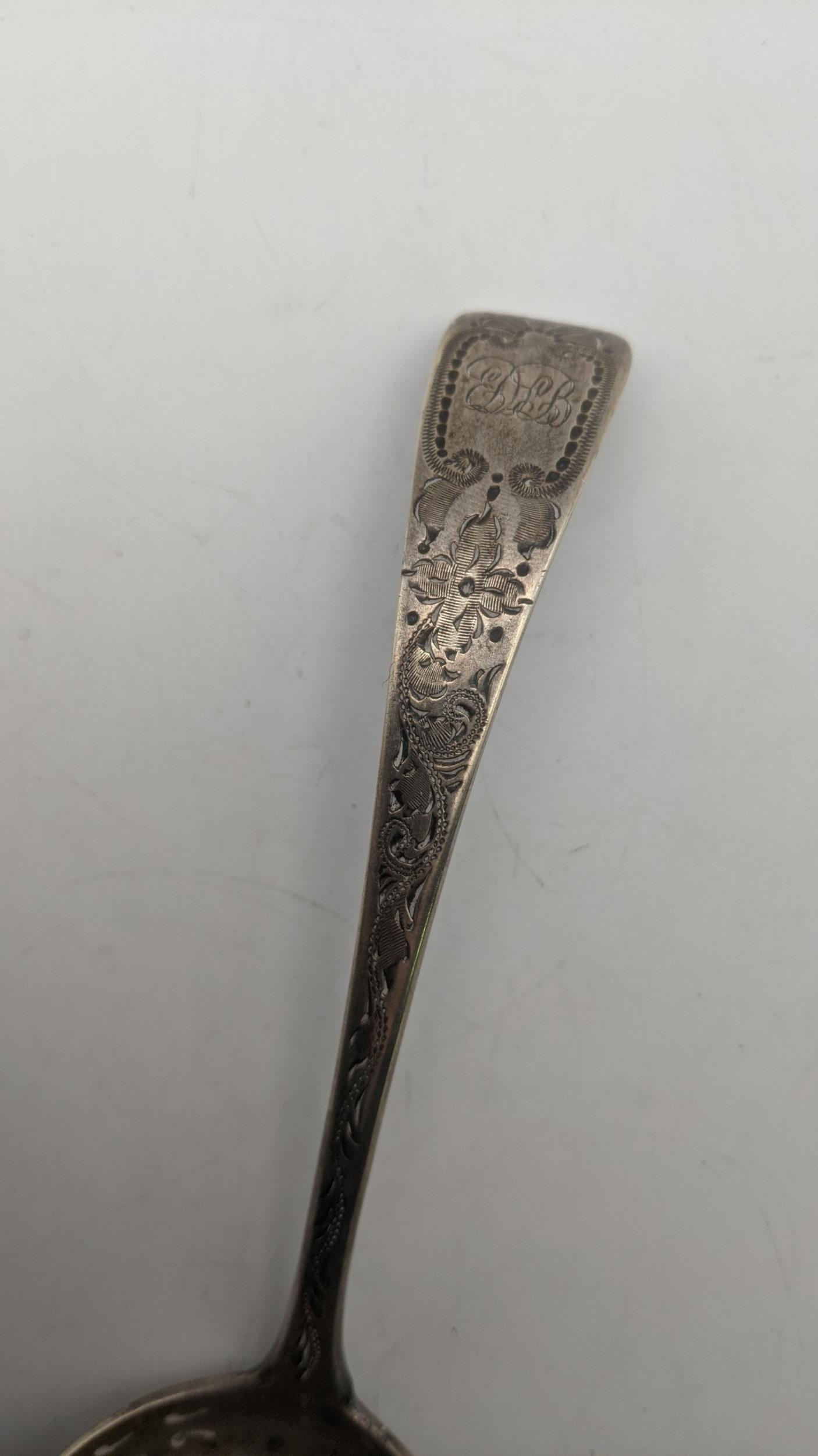 A silver sifter spoon with engraved and initiated ornament hallmarked London 1898, weight 50g - Image 3 of 3