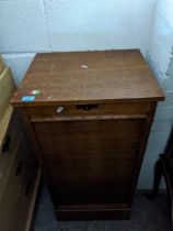 An early 20th century oak tambour fronted nine-drawer filing cabinet 94cm x 48.5cm x 39.5cm