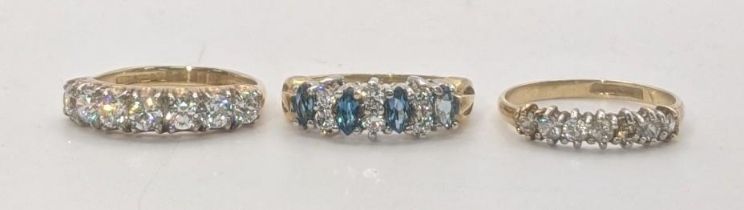 Three 9ct gold ladies rings to include one set with Topaz coloured and clear pace stones along