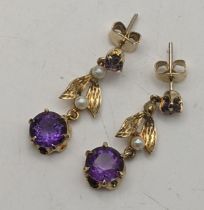 A pair of 9ct gold amethyst and pearl stud earrings 3.1g Location: If there is no condition report