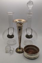 Silver to include a bottle coaster, a weighted vase and a pair of decanter labels with glass