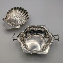 Two silver items to include a shell shaped butter dish along with a twin handled dish with pierced