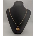 A 9ct gold St Christopher pendant and a 9ct gold necklace 18.65g Location: If there is no