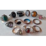 A group of 13 silver, white metal and silver tone dress rings with mixed cabochons, faceted glass