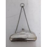 A George V silver ladies purse with leather fitted interior on a chain and suspension ring,