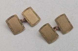 A pair of 9ct gold cufflinks having engraved boarders 4.6g Location: If there is no condition report