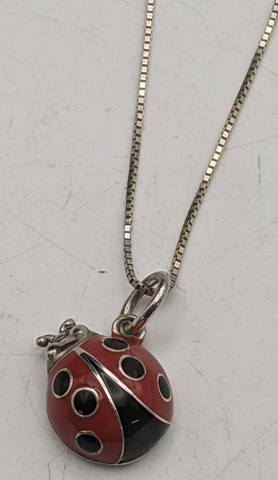 A Tiffany silver and enamelled lady bird pendant and two necklaces total weight 8.6g Location: If - Image 2 of 3