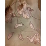 A large bolt of lightweight curtain fabric having a green ground with copper embellished floral