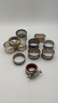 Silver to include an assortment of napkin rings to include a pair of engine turned napkin rings,