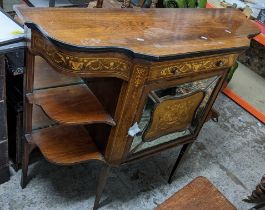 A late Victorian walnut cabinet having marquetry inlaid open shelves, single drawer and a mirrored