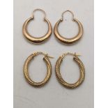 Two pairs of 9ct gold earrings to include a pair with a textured design, total weight 2.7g Location:
