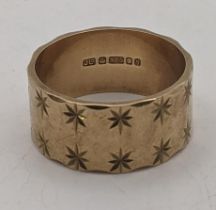 A 9ct gold wedding ring with star decoration 7.10g Location: If there is no condition report