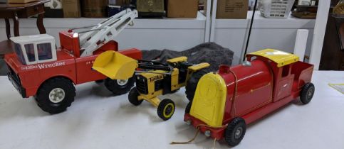 Three tin plate unboxed Diecast toys to include a Tonka front loading tractor, a Mighty Tonka