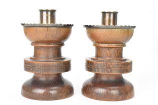 A pair of George V oak and silver topped candlesticks, by F J Ross & Sons (Frederick James Ross),