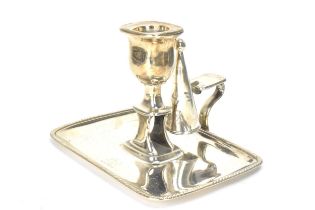 A George III silver chamberstick, hallmarked London 1797, the candle snuffer hallmarked London 1796,