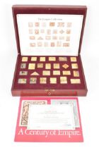 The Empire Collection, silver gilt replica stamps comprising twenty five replica stamps in a