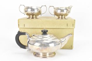 A George V silver three piece tea set by Mappin & Webb, hallmarked Birmingham 1913, each of globular