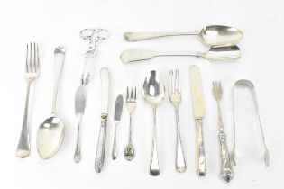 A selection of various silver utensils with various dates and makers to include a Victorian cheese