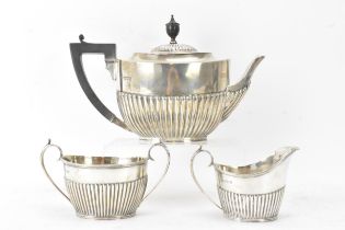 A Victorian silver matched three piece tea set, comprising a teapot hallmarked London 1897, a Mappin