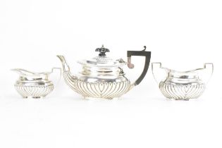 An early 20th century silver 'Bachelors' three piece tea set, by Jones & Crompton, the teapot