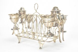 A George III silver combination egg cruet set, makers marks possibly for Thomas Liddiard, hallmarked