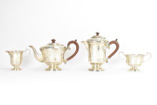 A George VI silver matched four piece, comprising a teapot hallmarked Birmingham 1945, coffee pot,