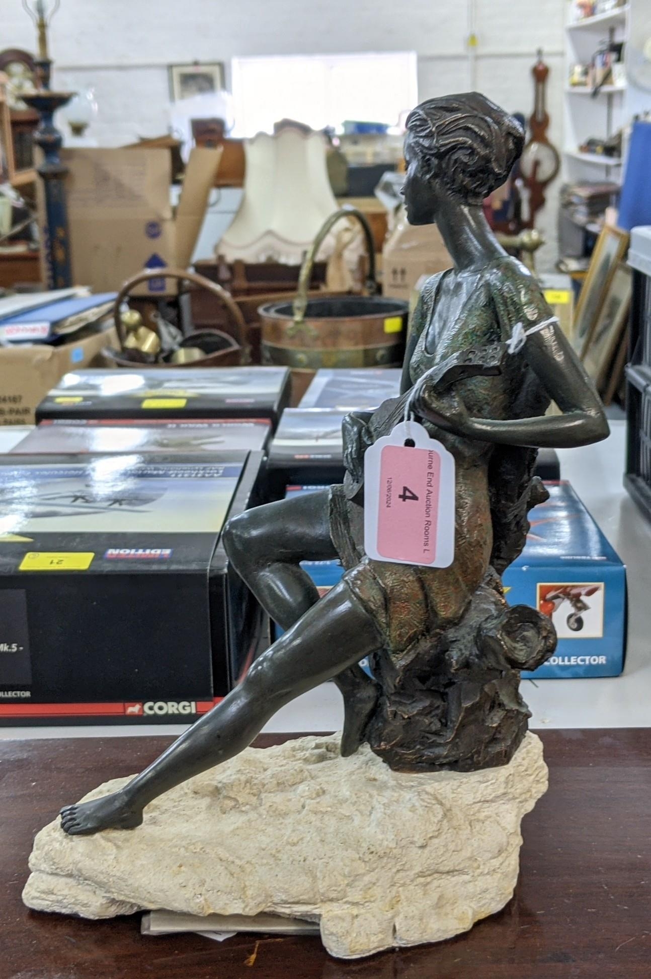 A bronze composite figure of a lady playing a banjo sat on a tree stump on a naturalistic base, - Image 2 of 8