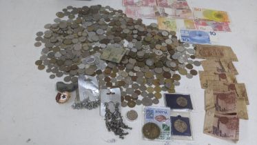 A collection of mostly foreign coinage and bank notes, tickets, Egypt 1 pounds and others, French